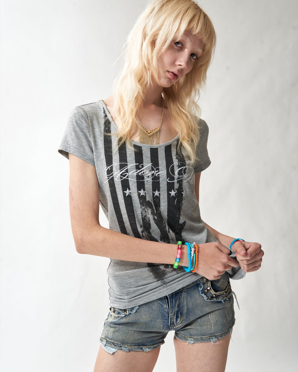 Distressed Flag Fitted Scoop-Neck T-Shirt by NUMBASIA, on a model