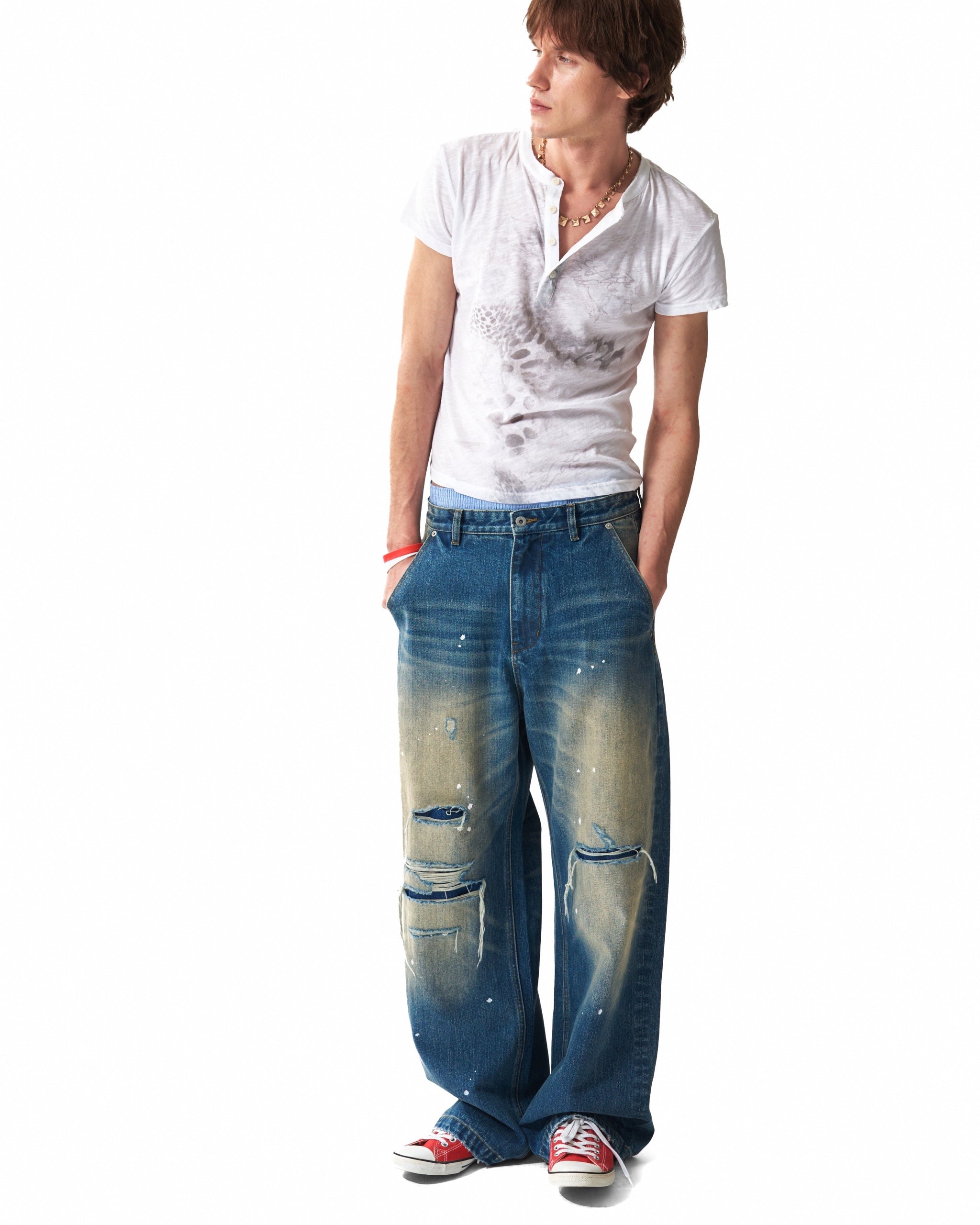 Distressed Leopard Flag Patch 13oz Baggy Jeans by NUMBASIA, on a model