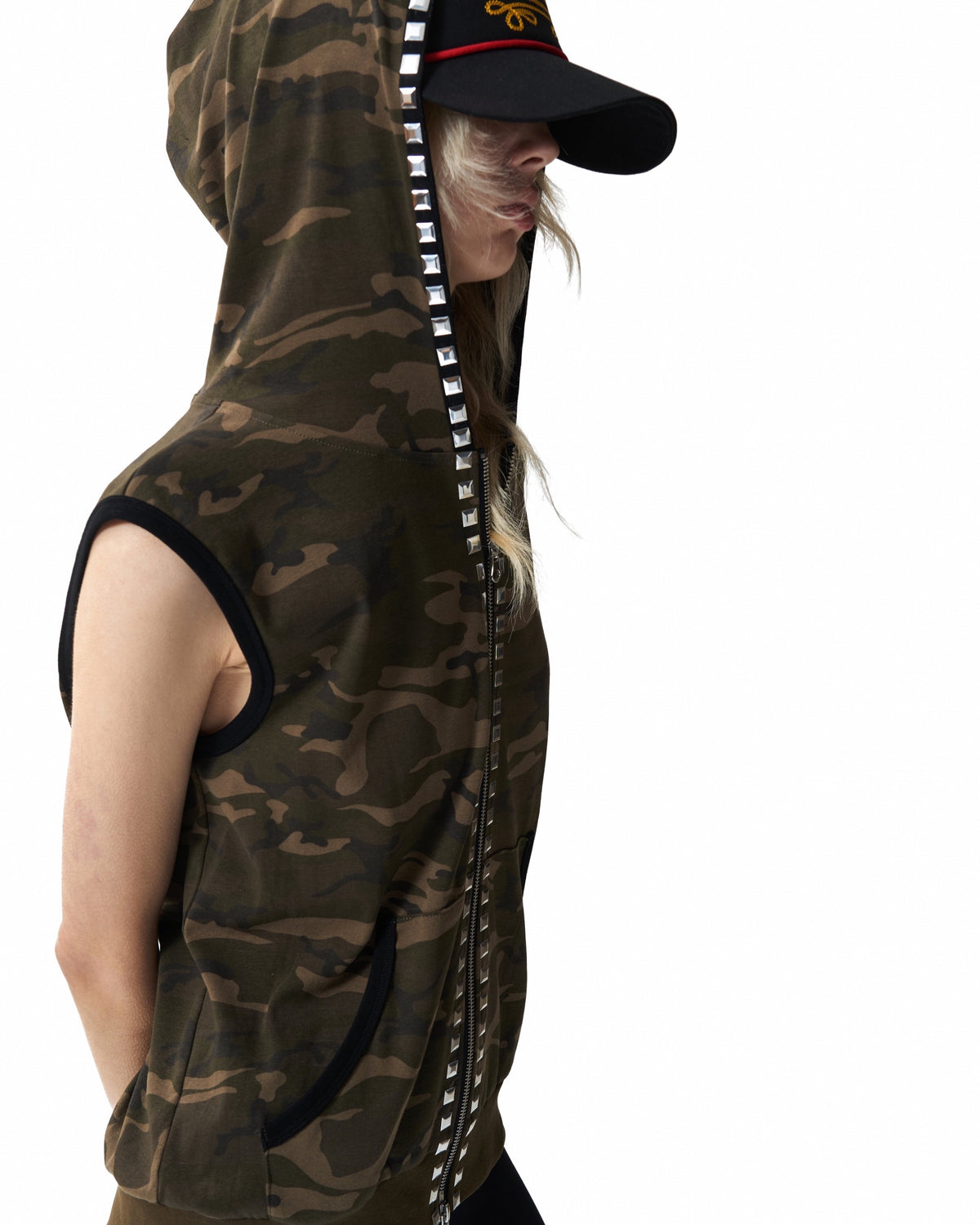 Studded Camo Hooded Zip Vest by NUMBASIA, on a model