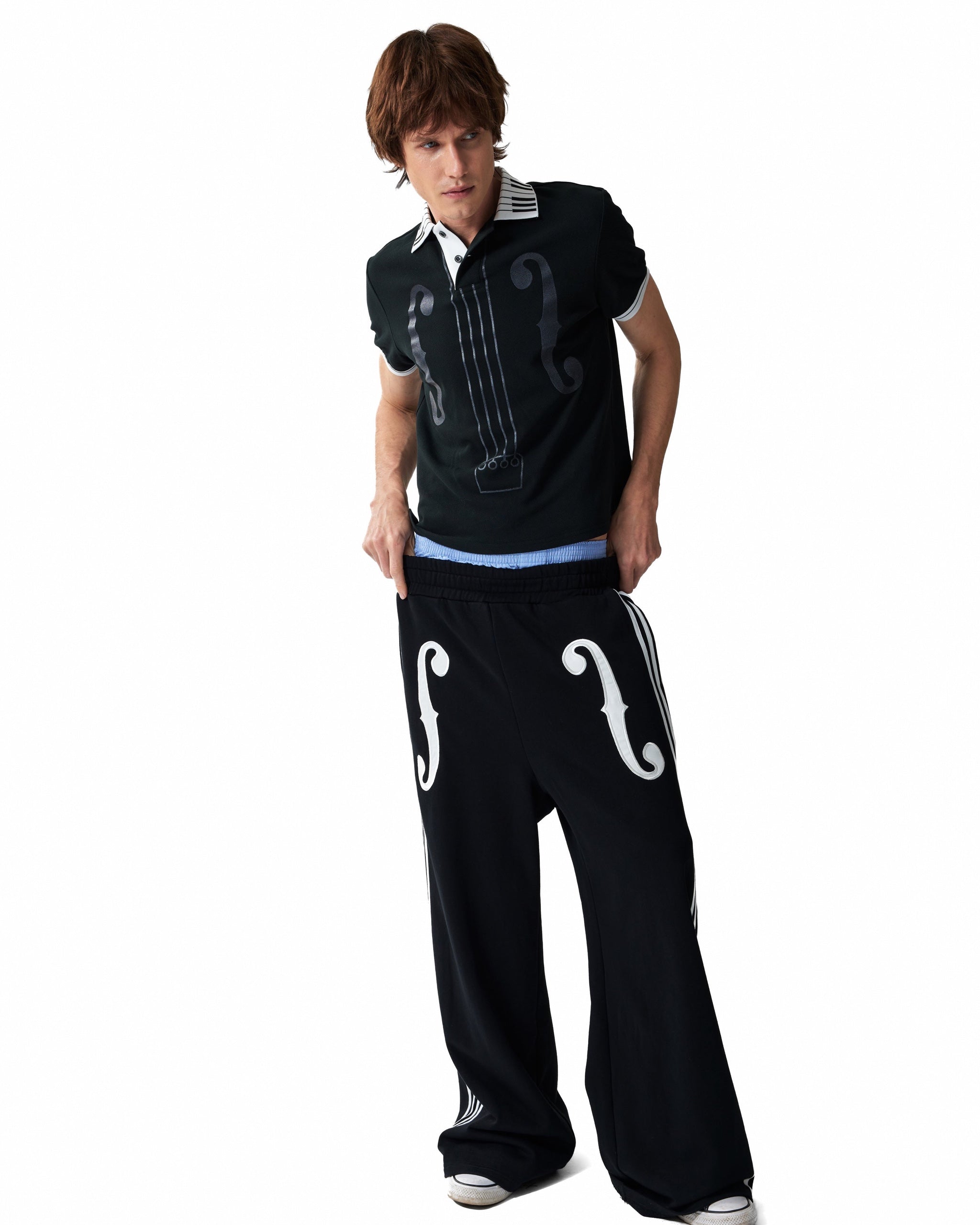 Violin Applique Striped Wide-Leg Sweatpants by NUMBASIA, on a model