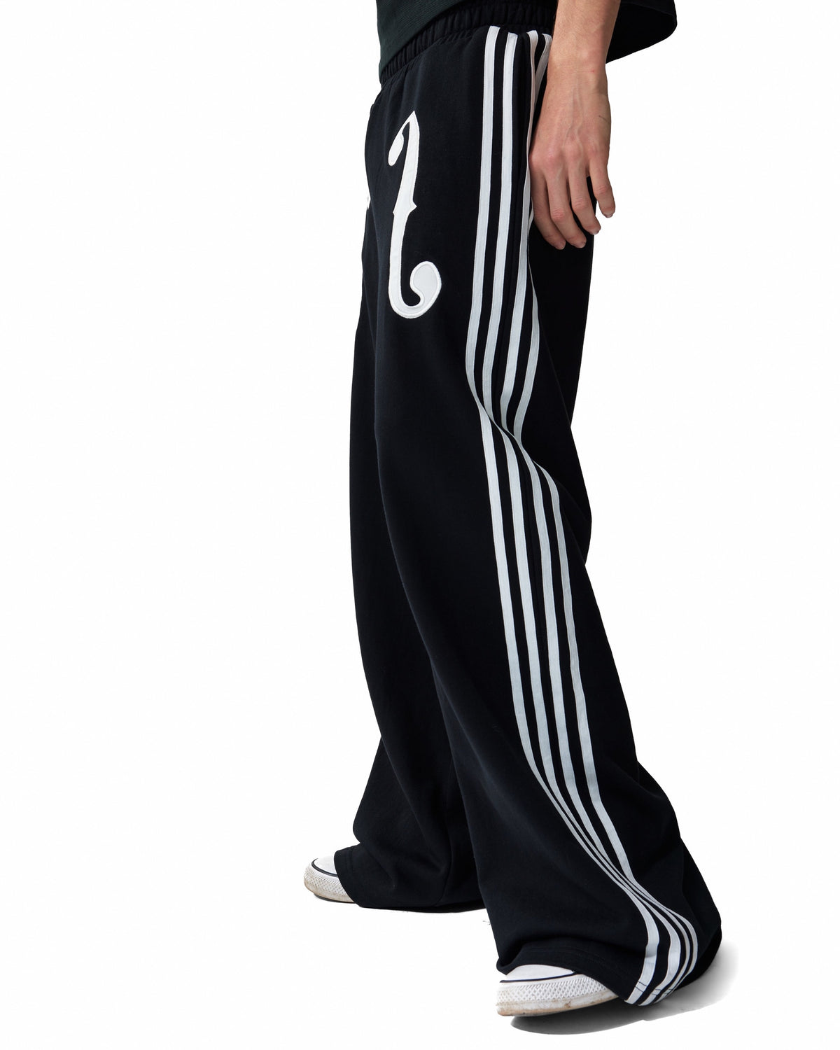 Violin Applique Striped Wide-Leg Sweatpants by NUMBASIA, on a model