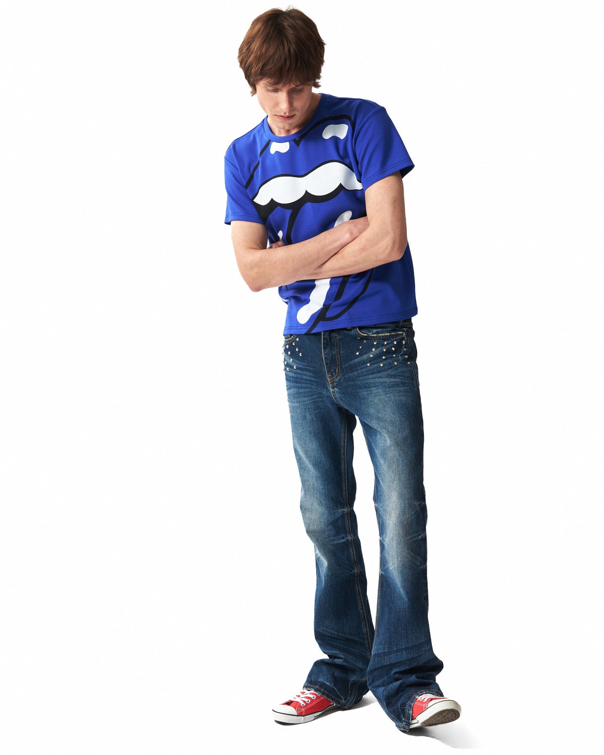 Spike-Studded Washed Flared Jeans by NUMBASIA, on a model