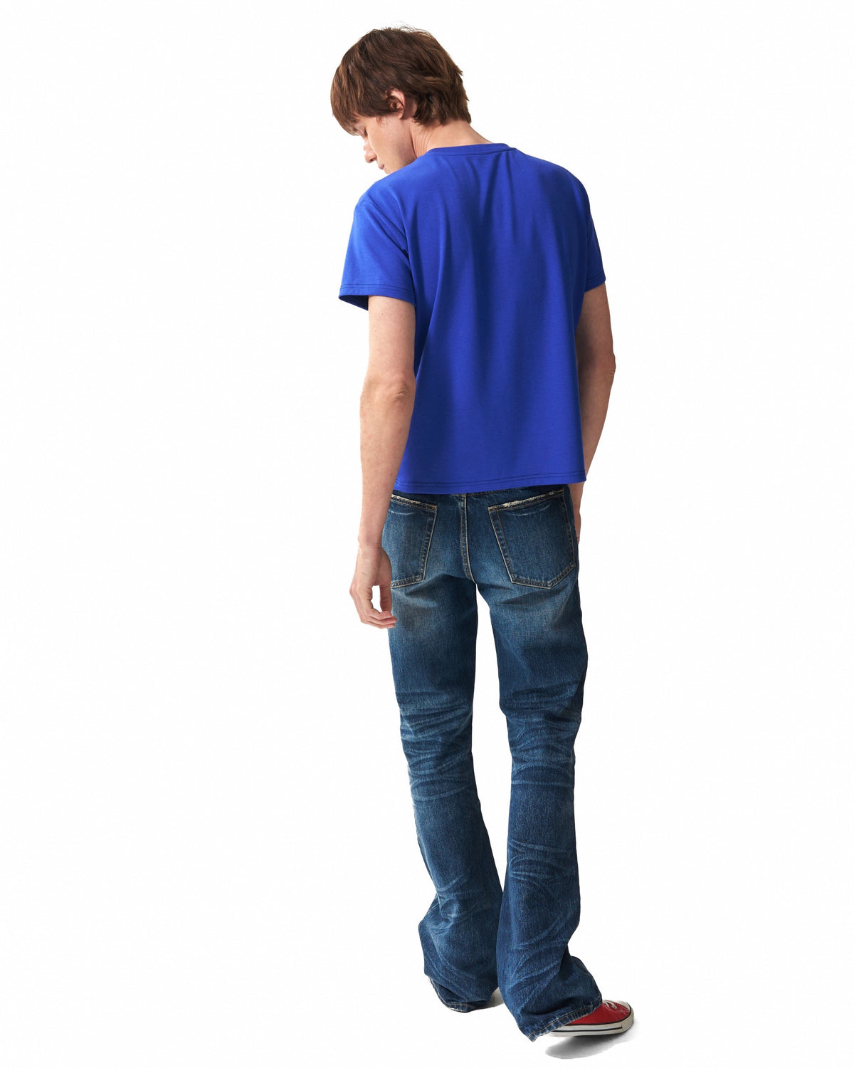 Spike-Studded Washed Flared Jeans by NUMBASIA, on a model