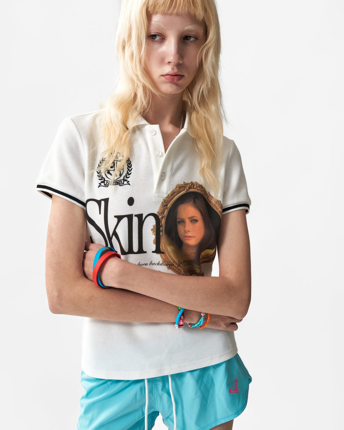 Skins Portrait Embroidered Polo by NUMBASIA, on a model