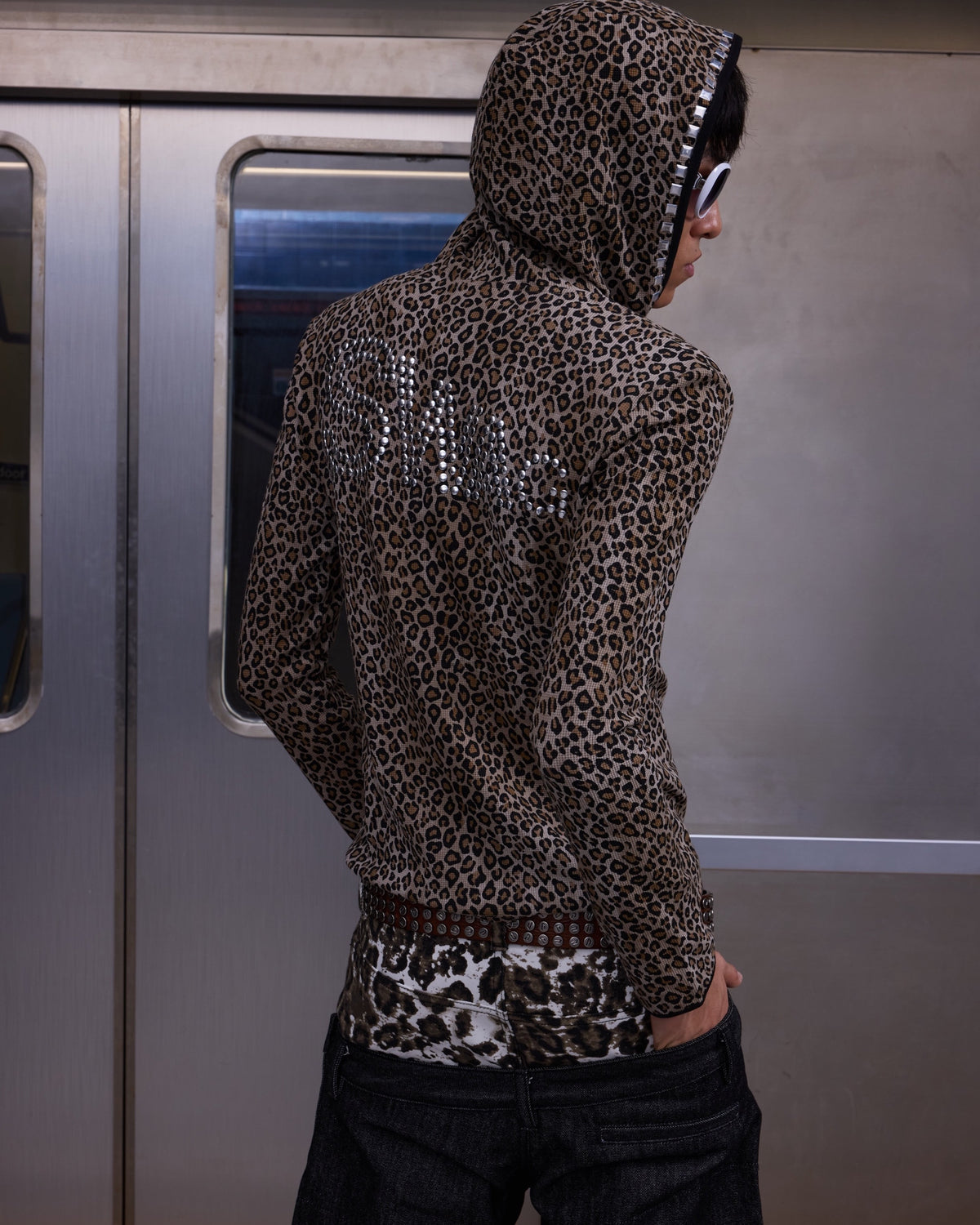 SWAG Rhinestone Leopard Zip Hoodie by NUMBASIA, on a model