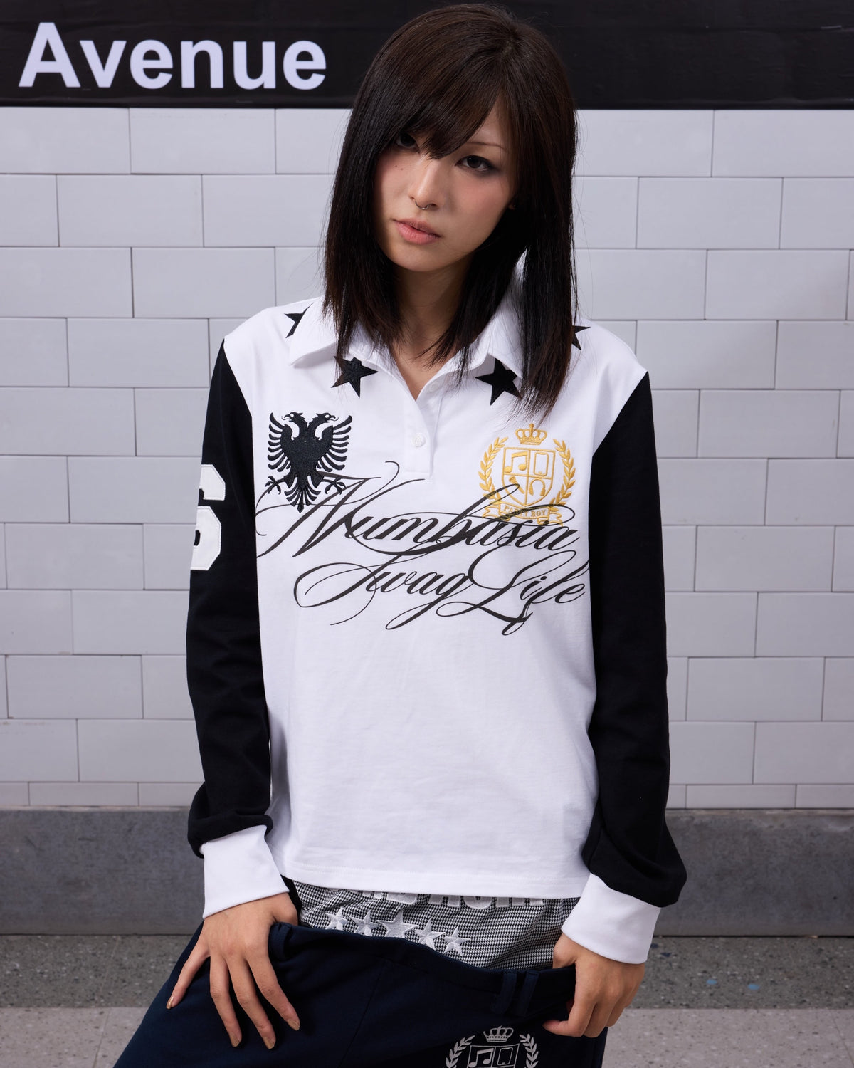 Star Embroidered Logo Long Sleeve Polo by NUMBASIA, on a model