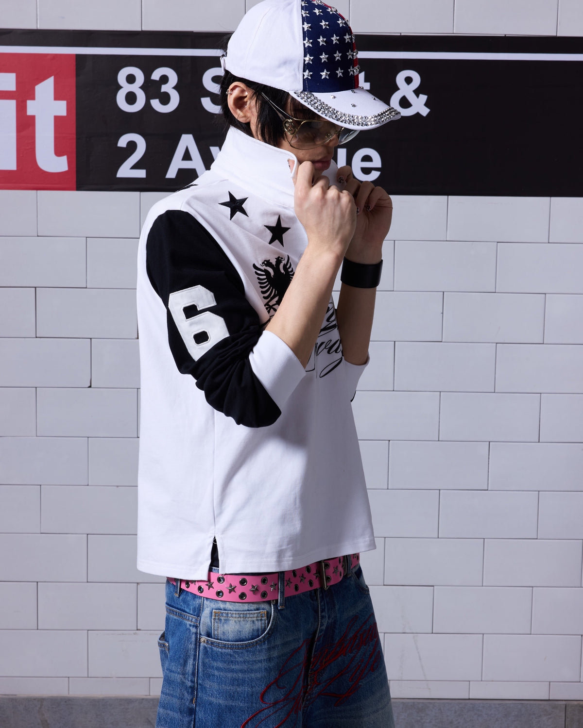 Star Embroidered Logo Long Sleeve Polo by NUMBASIA, on a model