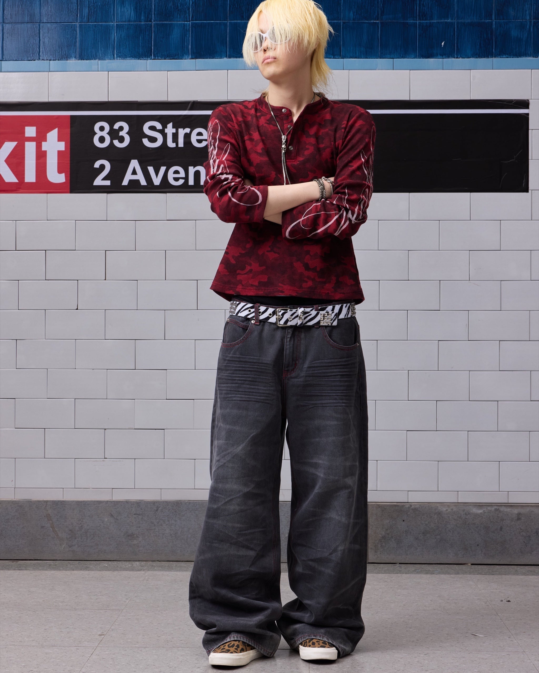 Wing Star Print Contrast-Stitch Baggy Jeans by NUMBASIA, on a model
