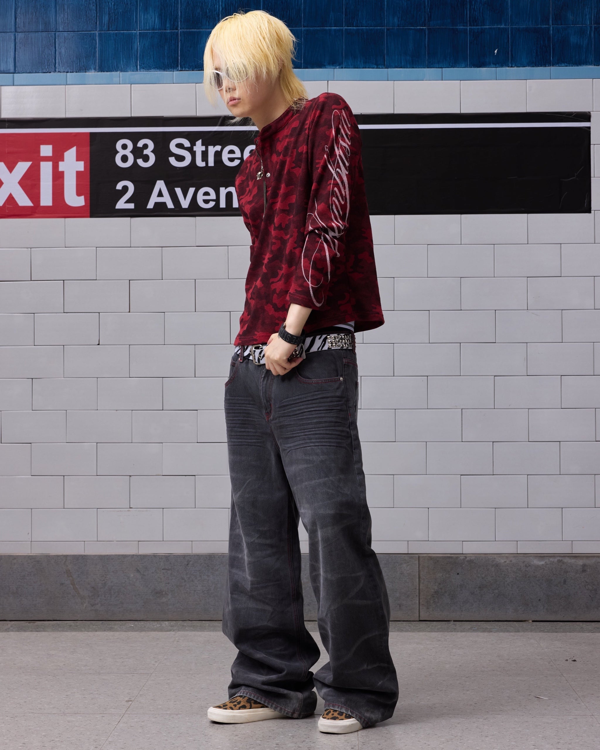 Wing Star Print Contrast-Stitch Baggy Jeans by NUMBASIA, on a model