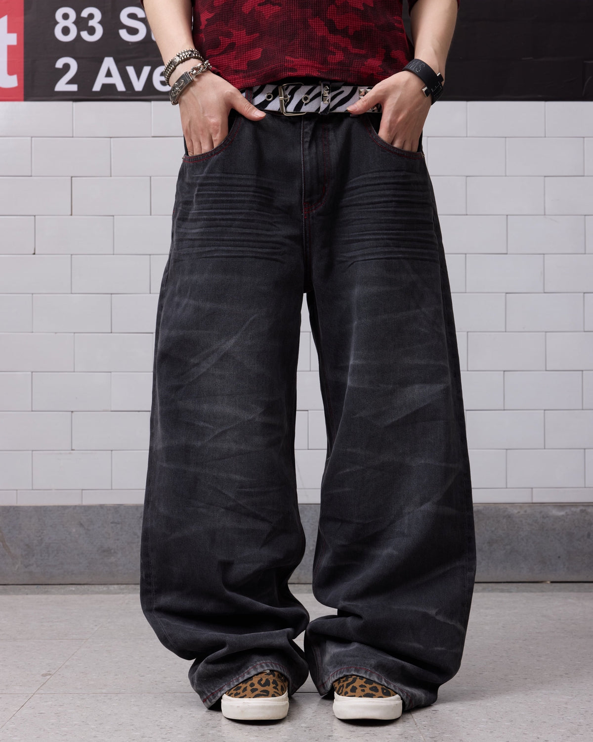 Wing Star Print Contrast-Stitch Baggy Jeans by NUMBASIA, on a model