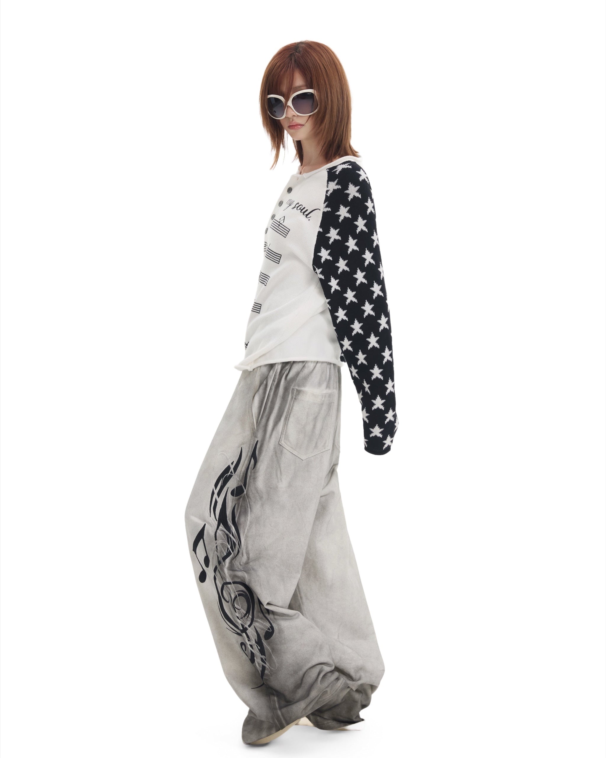 Music Note Star Raglan Knit Henley by NUMBASIA, on a model