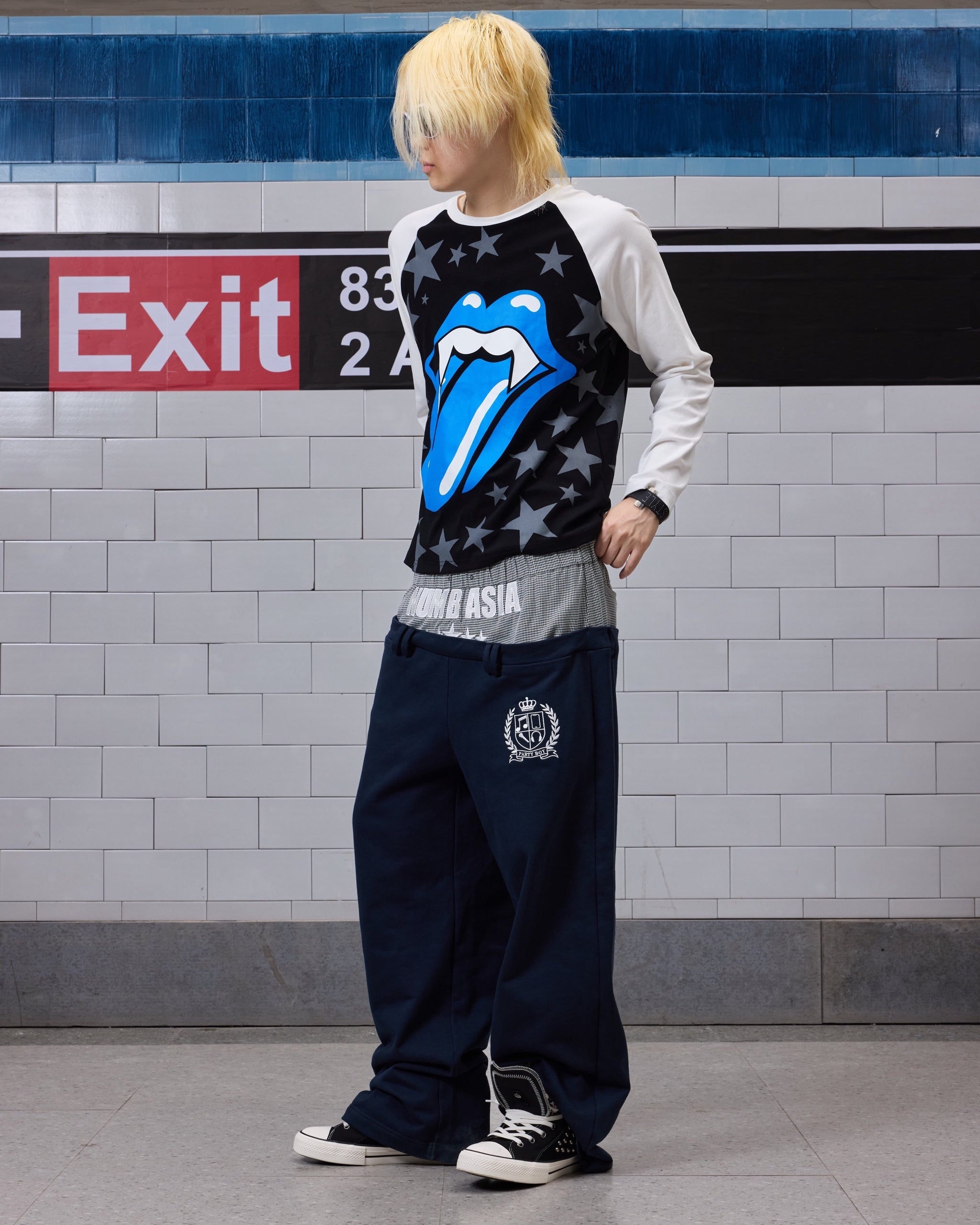 Star Embroidered Double-Waist Baggy Sweatpants by NUMBASIA, on a model