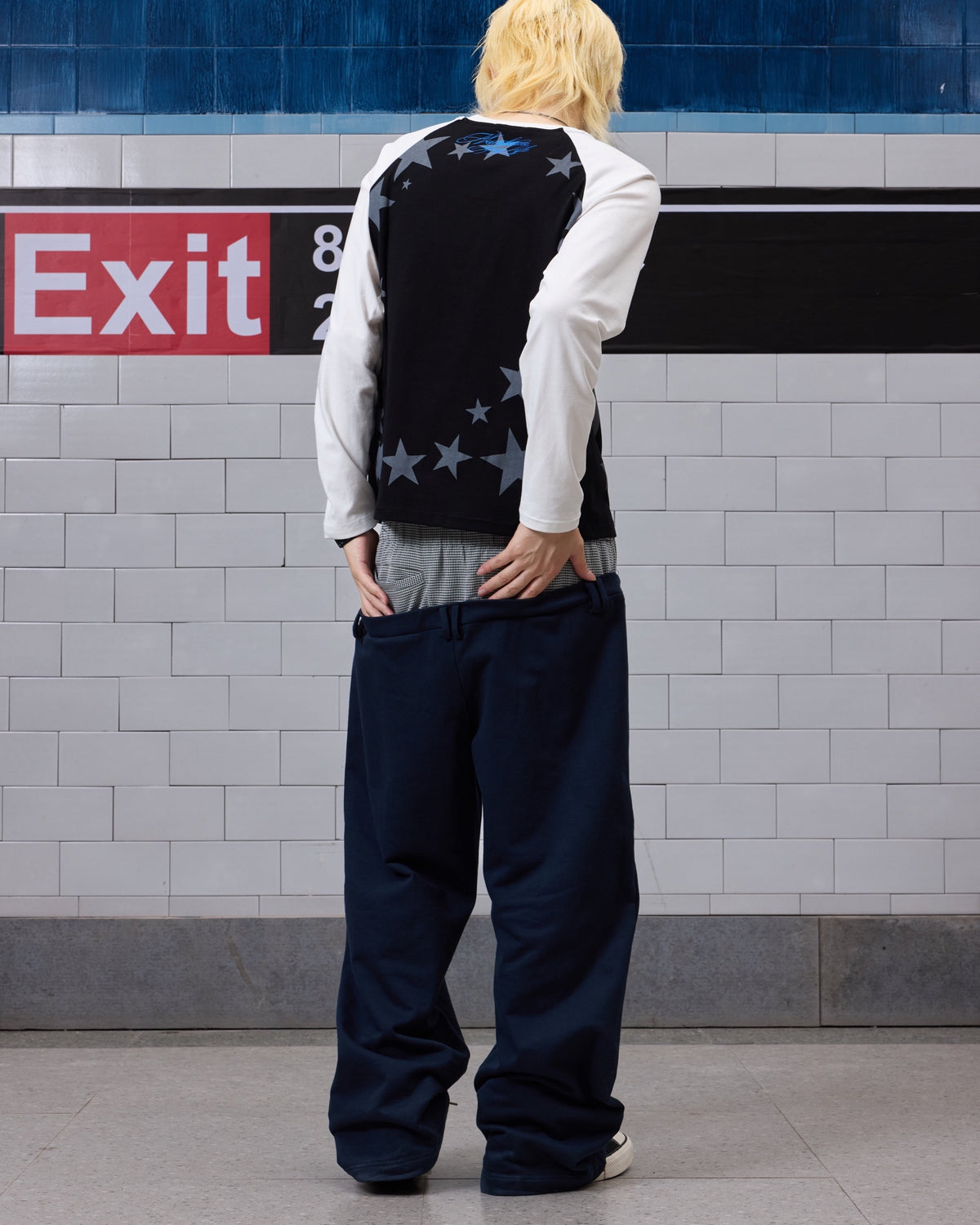 Star Embroidered Double-Waist Baggy Sweatpants by NUMBASIA, on a model