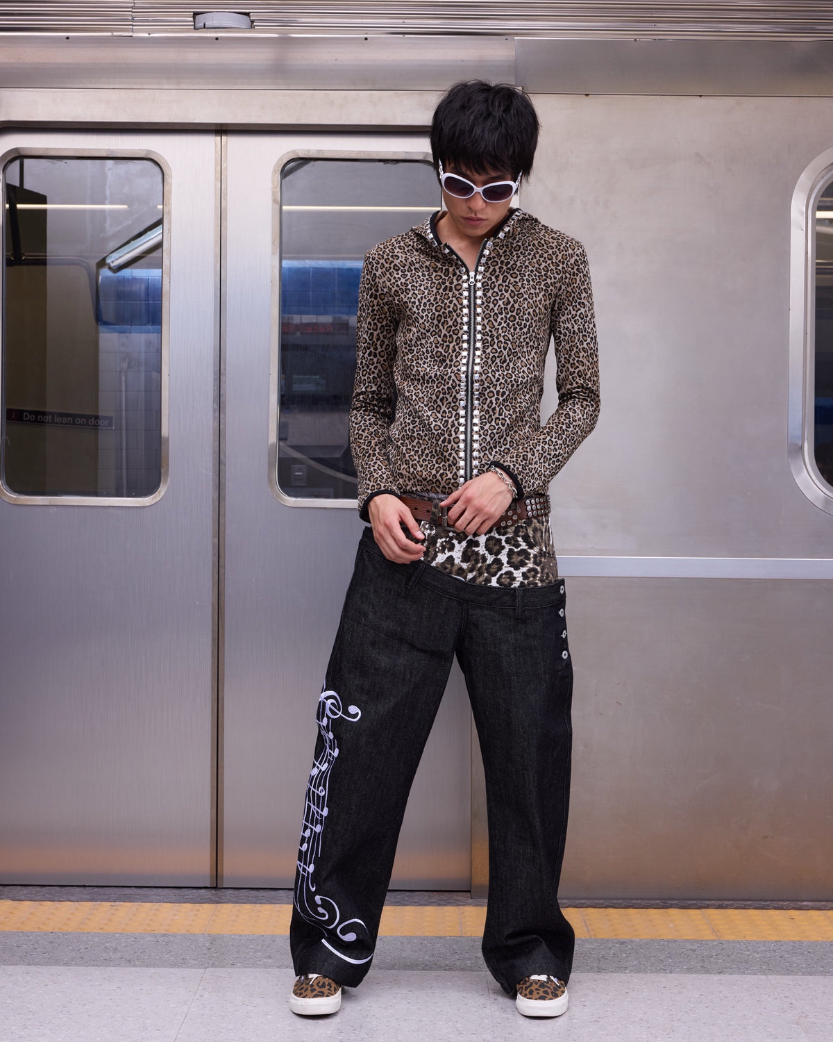 Leopard Double-Waist Music Note 13oz Baggy Jeans by NUMBASIA, on a model