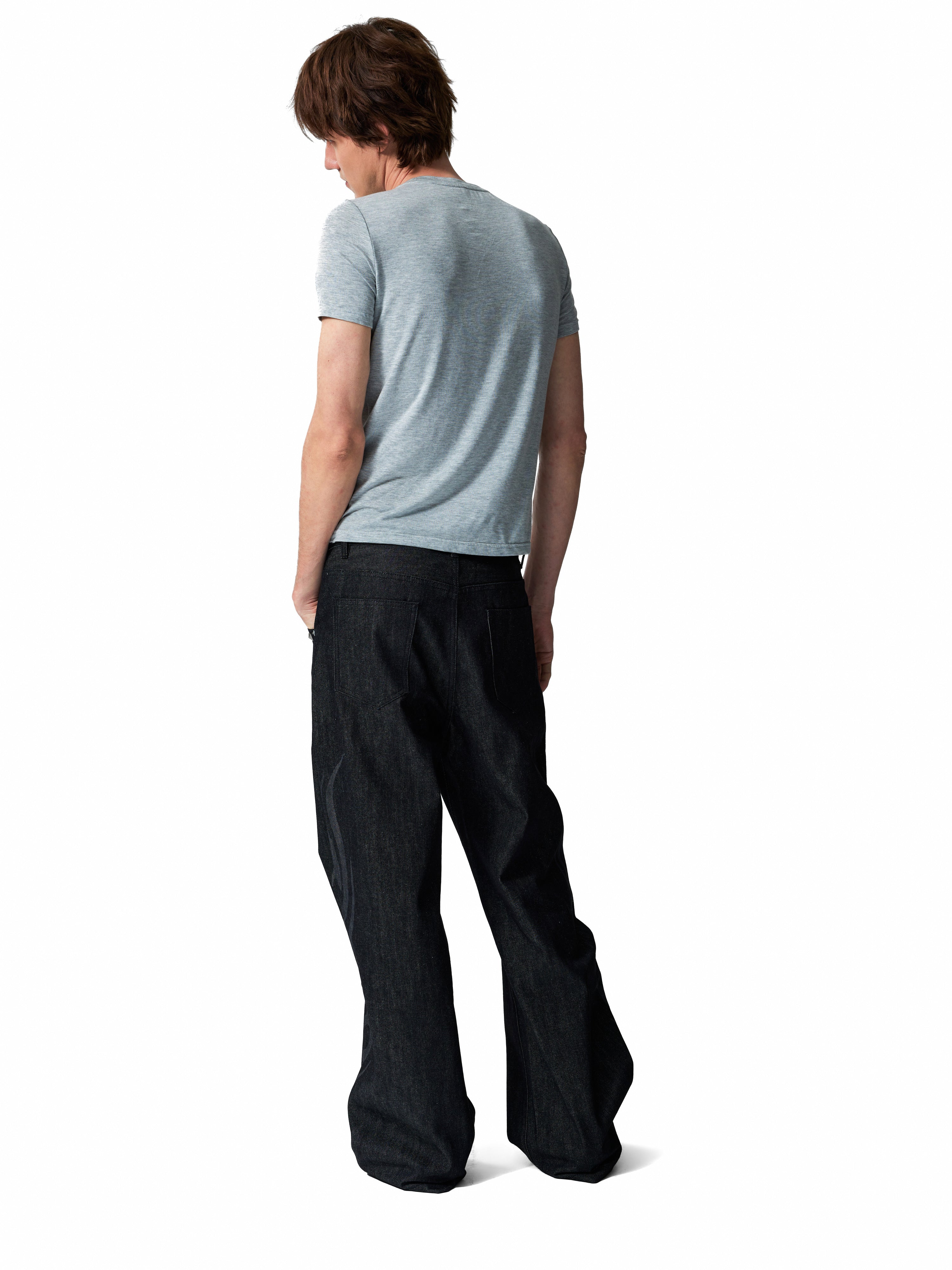 NUMBASIA Burnout Motif Studded 13oz Baggy Raw Denim Jeans — studio model view 3